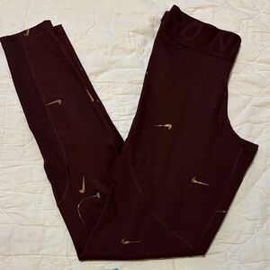 Nike Burgundy Leggings with Metallic Accents